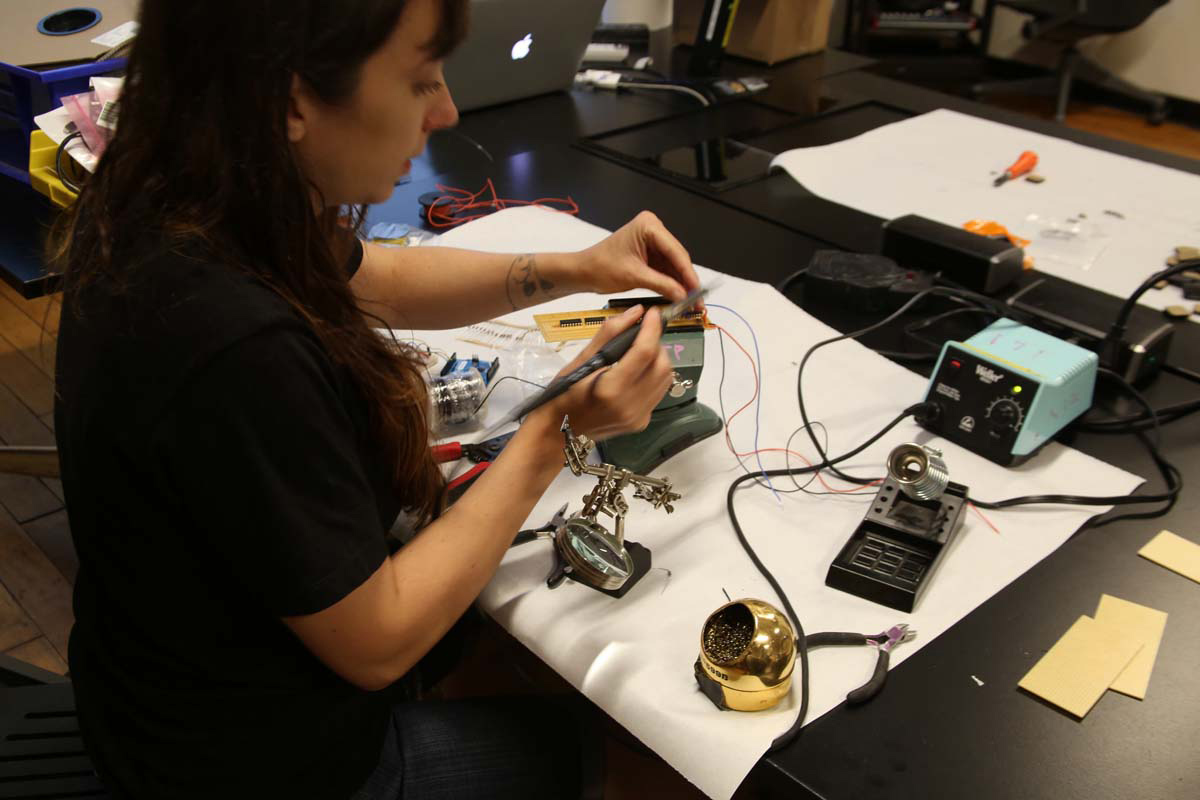 a person soldering